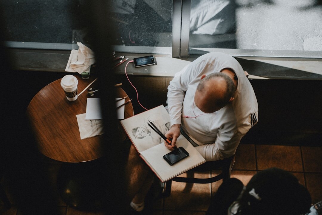 man writing advertisement